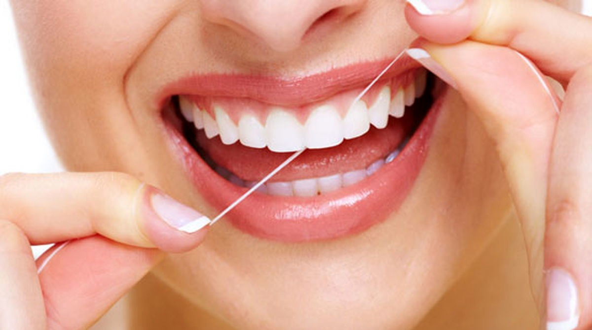 نخ دندان زدن - از بین بردن زردی دندان