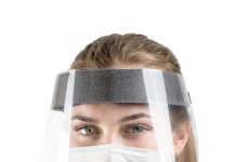 A person wearing a face shield Description automatically generated