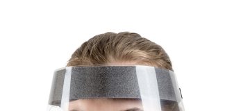 A person wearing a face shield Description automatically generated